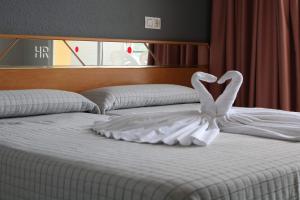 Ліжко або ліжка в номері Hotel Reymar Playa