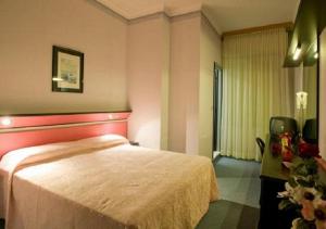 Postel nebo postele na pokoji v ubytování Hotel Ida
