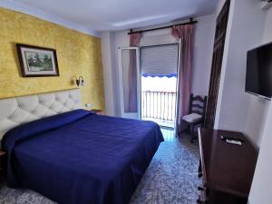 Postel nebo postele na pokoji v ubytování Hotel Doña Carmen + 37 fotografií