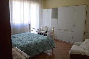 A bed or beds in a room at Appartamento in paese