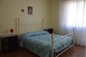 Postel nebo postele na pokoji v ubytování Appartamento in paese + 8 fotografií
