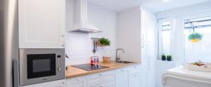 Kuchyň nebo kuchyňský kout v ubytování Apartamento de diseño centrico con terraza espectacular