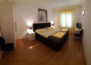Postel nebo postele na pokoji v ubytování Apartmani Matušan