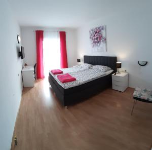 Postel nebo postele na pokoji v ubytování Apartmani Matušan