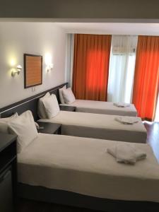 Tempat tidur dalam kamar di Hotel Balca