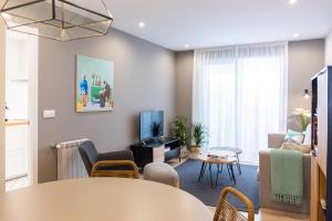 TV a/nebo společenská místnost v ubytování Apartamento de diseño centrico con terraza espectacular