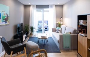 Posezení v ubytování Apartamento de diseño centrico con terraza espectacular