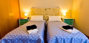 Posteľ alebo postele v izbe v ubytovaní Apartamentos Albero