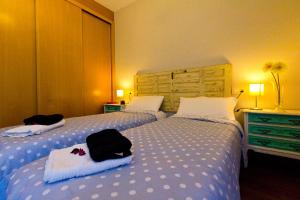 Posteľ alebo postele v izbe v ubytovaní Apartamentos Albero