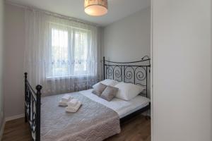 Posteľ alebo postele v izbe v ubytovaní Apartament 24 ul.Proletariacka 2A centrum