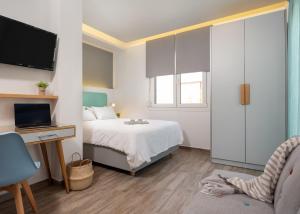 Postel nebo postele na pokoji v ubytování Kochyli Garden Studios