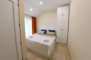 a small bedroom with a bed and a window at VIP Sweet Home in Shekvetili in Shekvetili