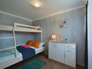 a bedroom with two bunk beds and a desk at FISHKA HOUSE Domek wypoczynkowy in Zator