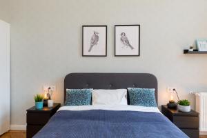 A bed or beds in a room at Royal Ferenciek Apartment