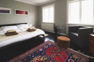 A bed or beds in a room at Hoepfner and Tulinus Historical Houses