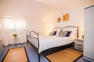 En eller flere senge i et værelse på Apartments Terra