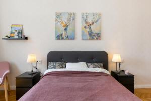 A bed or beds in a room at Royal Ferenciek Apartment
