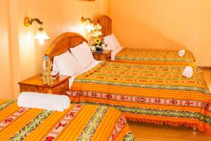 Postel nebo postele na pokoji v ubytování Hotel Santafe Inn