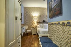 a hotel room with a bedroom with a bed at Casona De Torres in Mondéjar