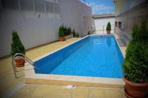a swimming pool in the middle of a building at Rusalka Apart-Residence in Obzor