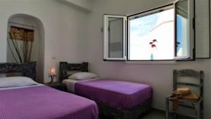 A bed or beds in a room at Sofi Rooms