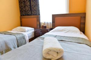 Letto o letti in una camera di Friendly Guest House