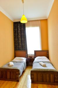 Letto o letti in una camera di Friendly Guest House