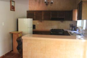 Kuchyň nebo kuchyňský kout v ubytování Quinta Comala Hotel & Villas