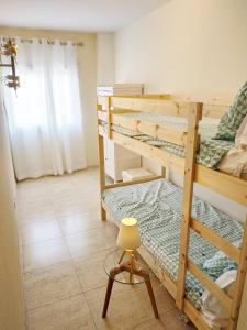 Llit o llits en una habitació de tarragonaapartments Fortuny Reus