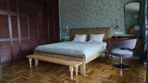 a bedroom with a bed and a desk and a chair at 160 degrees in Tbilisi City