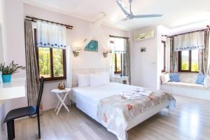 Postel nebo postele na pokoji v ubytování Masal Tatil Evi