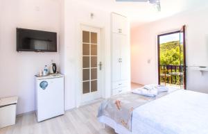 Postel nebo postele na pokoji v ubytování Masal Tatil Evi