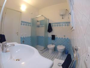 a bathroom with a sink and a toilet at Luigi Apartments&Rooms in Pula +78 photos