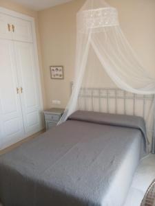 A bed or beds in a room at Ático Aretusa