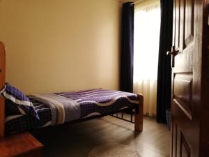 Кровать или кровати в номере Budget Room in Kileleshwa