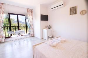 Postel nebo postele na pokoji v ubytování Masal Tatil Evi