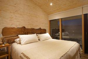 Cama o camas de una habitación en Hotel & Cafe Veliche