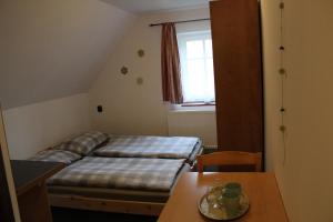 Postel nebo postele na pokoji v ubytování Penzion "V Zelený"