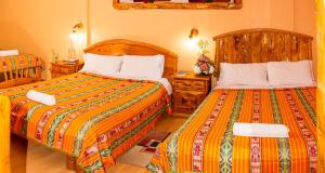 Postel nebo postele na pokoji v ubytování Hotel Santafe Inn