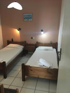 Ένα ή περισσότερα κρεβάτια σε δωμάτιο στο Litsa Efi