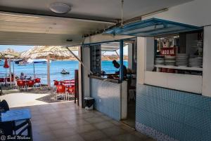a restaurant with a view of the ocean at Suite Big Lanche in Praia Baixo +15 photos