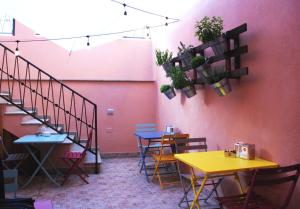 a room with tables and chairs and a staircase at camere pula in Pula