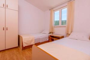 Posteľ alebo postele v izbe v ubytovaní Apartments Vincic