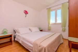 Posteľ alebo postele v izbe v ubytovaní Apartments Vincic