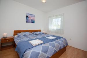 Postel nebo postele na pokoji v ubytování Apartments Slobodanka