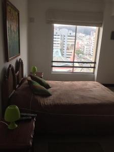 Voodi või voodid majutusasutuse Suites Parque Real toas