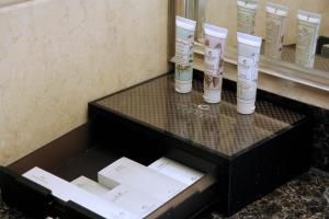 a counter with two tubes of hair products in a bathroom at The Royal Marina Plaza Hotel Guangzhou in Guangzhou