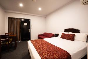 Cama o camas de una habitación en Hotel Settlers