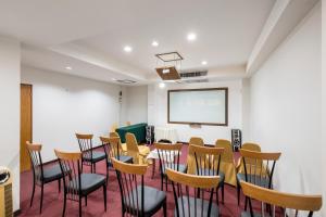 a conference room with a table and chairs at JL Bangkok Hotel in Bangkok