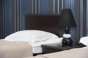 Voodi või voodid majutusasutuse Hotel Like toas